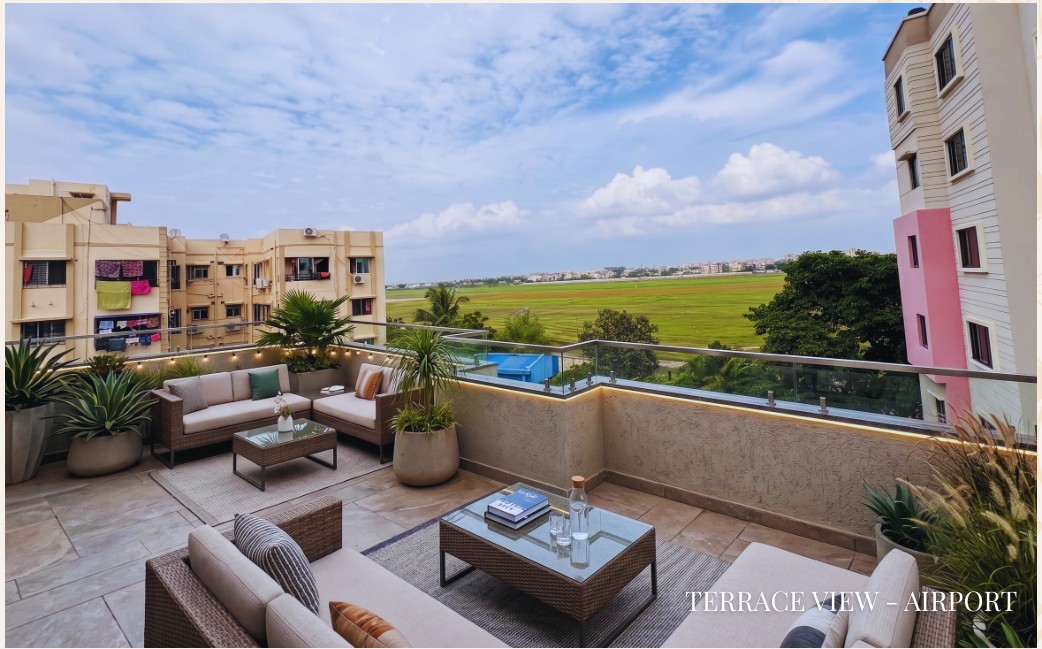 Tulsi Tower Landscaped Rooftop Terrace with Airport Runway View